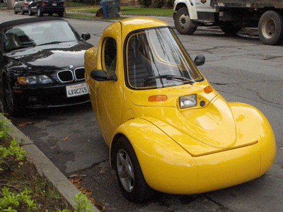 Yellow electric three-wheeled car